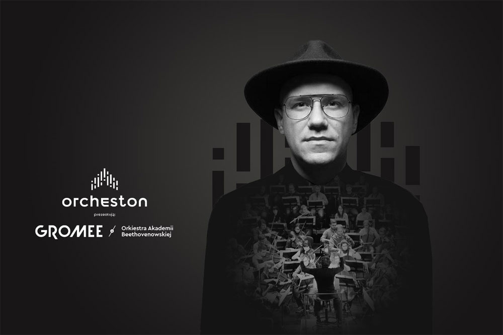 Na zdjęciu portret en face Gromee. Mężczyzna w kapeluszu i okularach. Na tle klatki wkomponowane zdjęcie orkiestry.